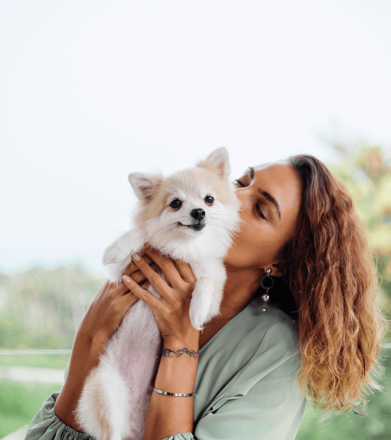 women with white cute little dog